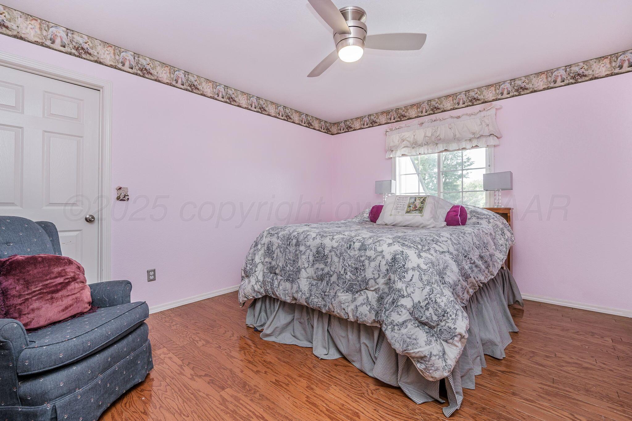 7809 Bent Tree Drive Amarillo, TX 79121 - Photo 25 of 31 a living room with furniture and a chandelier