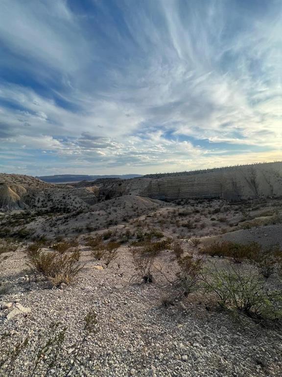 100 Needle Peak Road Terlingua, TX 79852 - Photo 13 of 20 a view of a dry yard with wooden fence