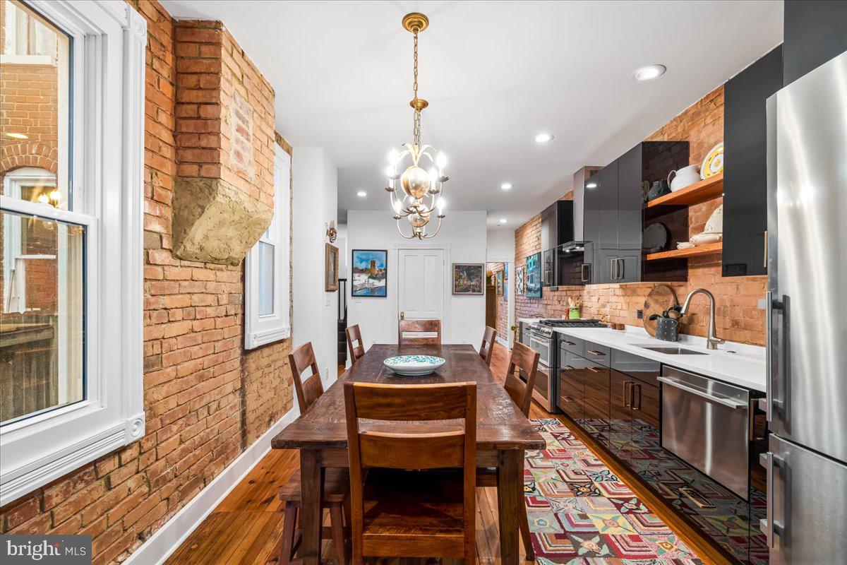 338 East Church Street Frederick, MD 21701 - Photo 14 of 54 a kitchen with a table and chairs