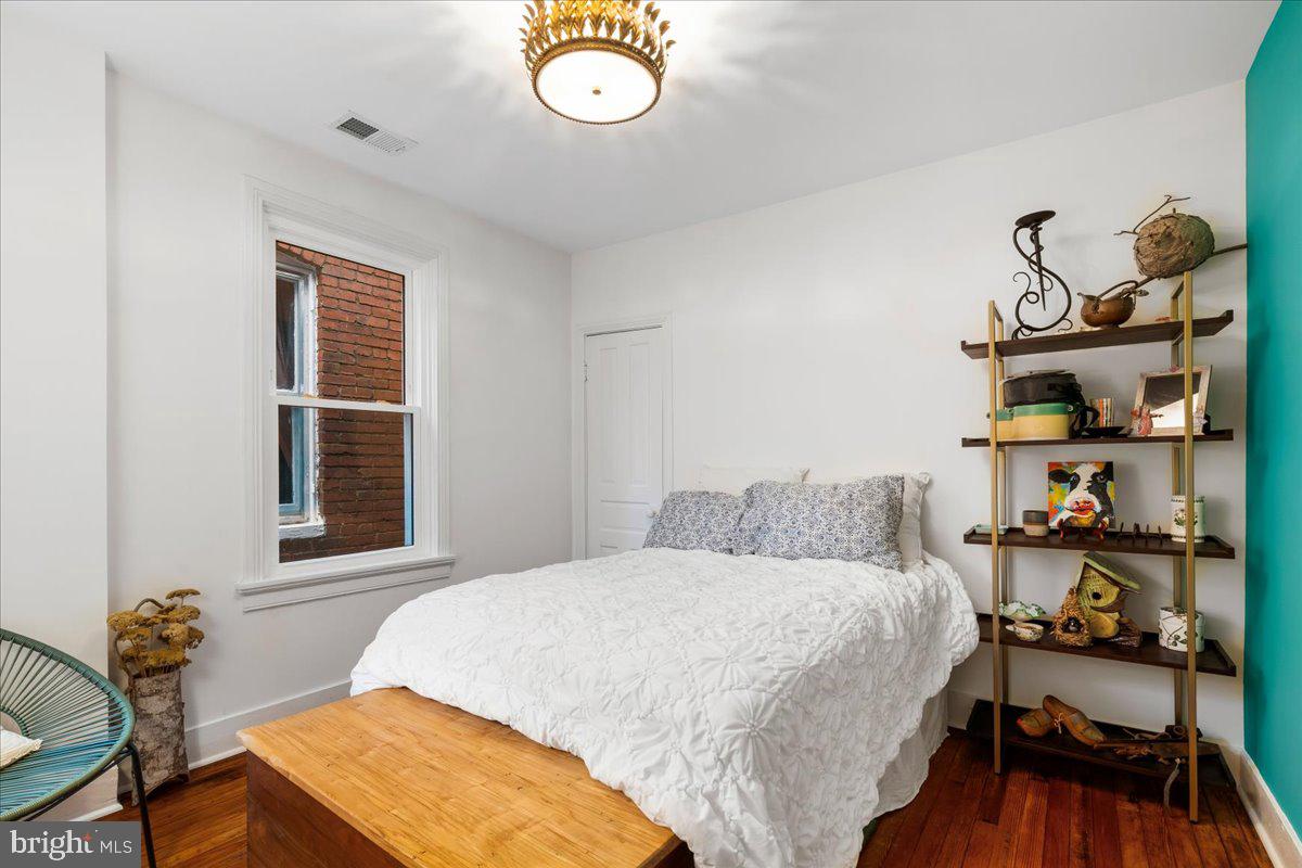 338 East Church Street Frederick, MD 21701 - Photo 21 of 54 a bedroom with a bed and a window