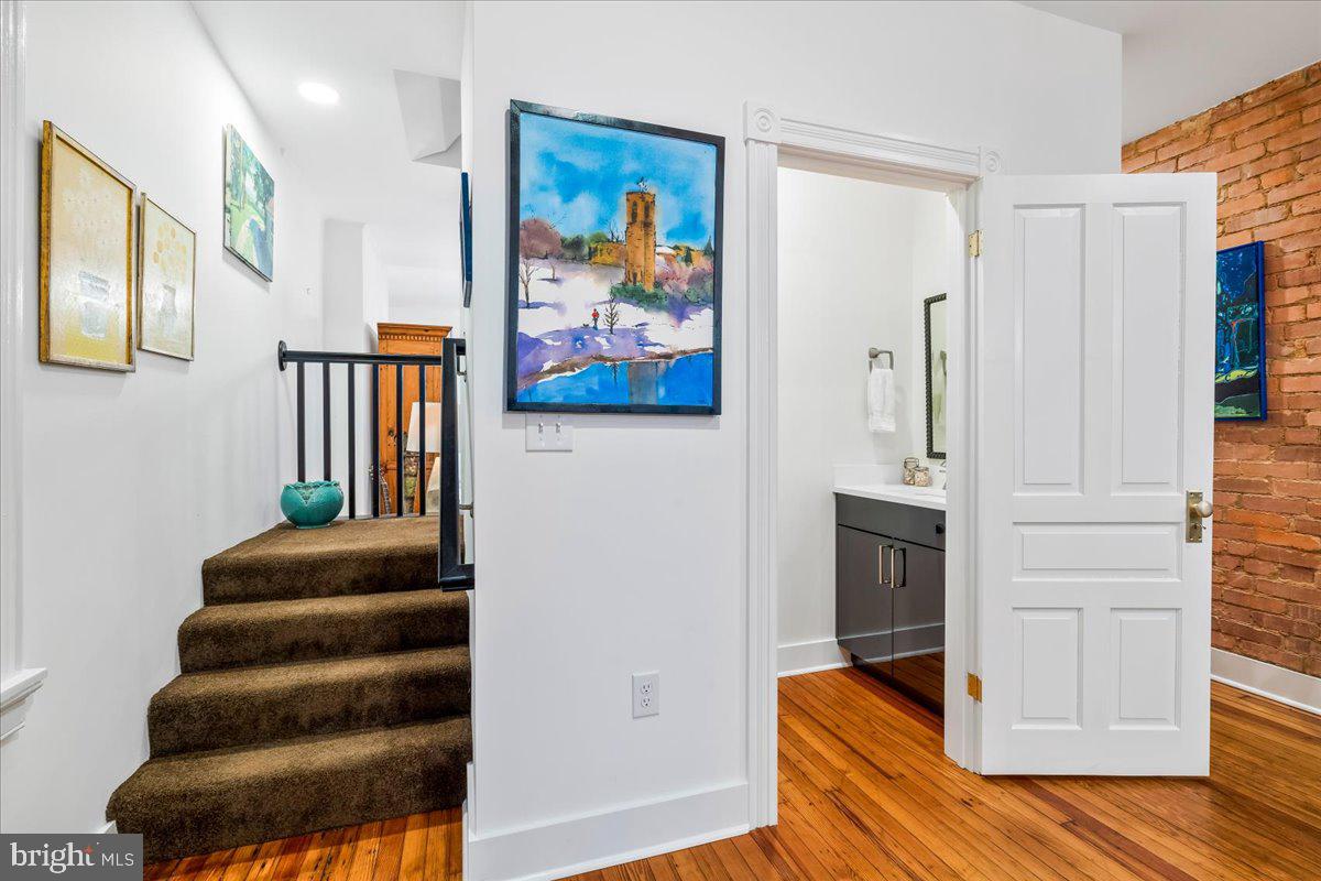 338 East Church Street Frederick, MD 21701 - Photo 6 of 54 a view of entryway and hall with wooden floor