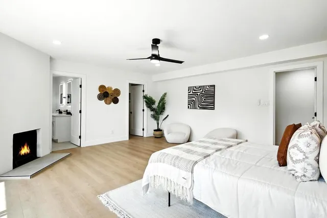 a bedroom with a bed and a fireplace