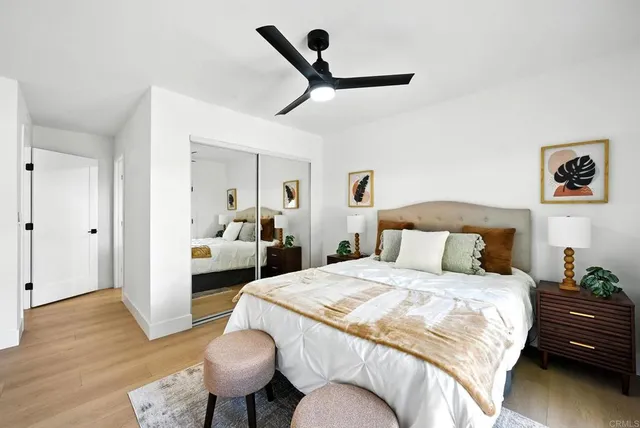 a bedroom with a bed and a couch