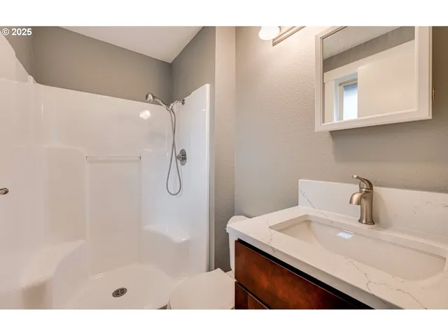 a bathroom with a sink a mirror and a bathtub