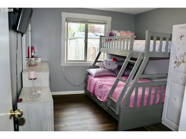 a bedroom with furniture and a window