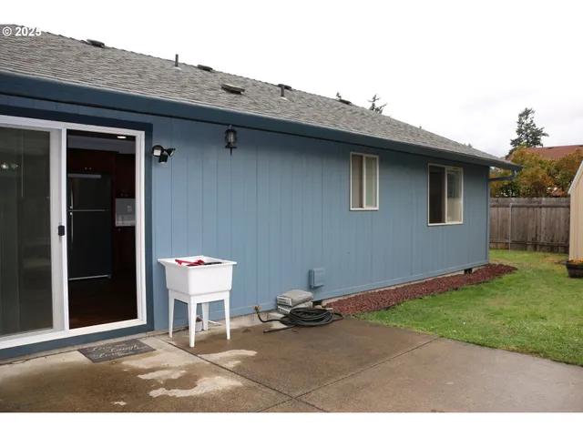 a backyard of a house with seating space