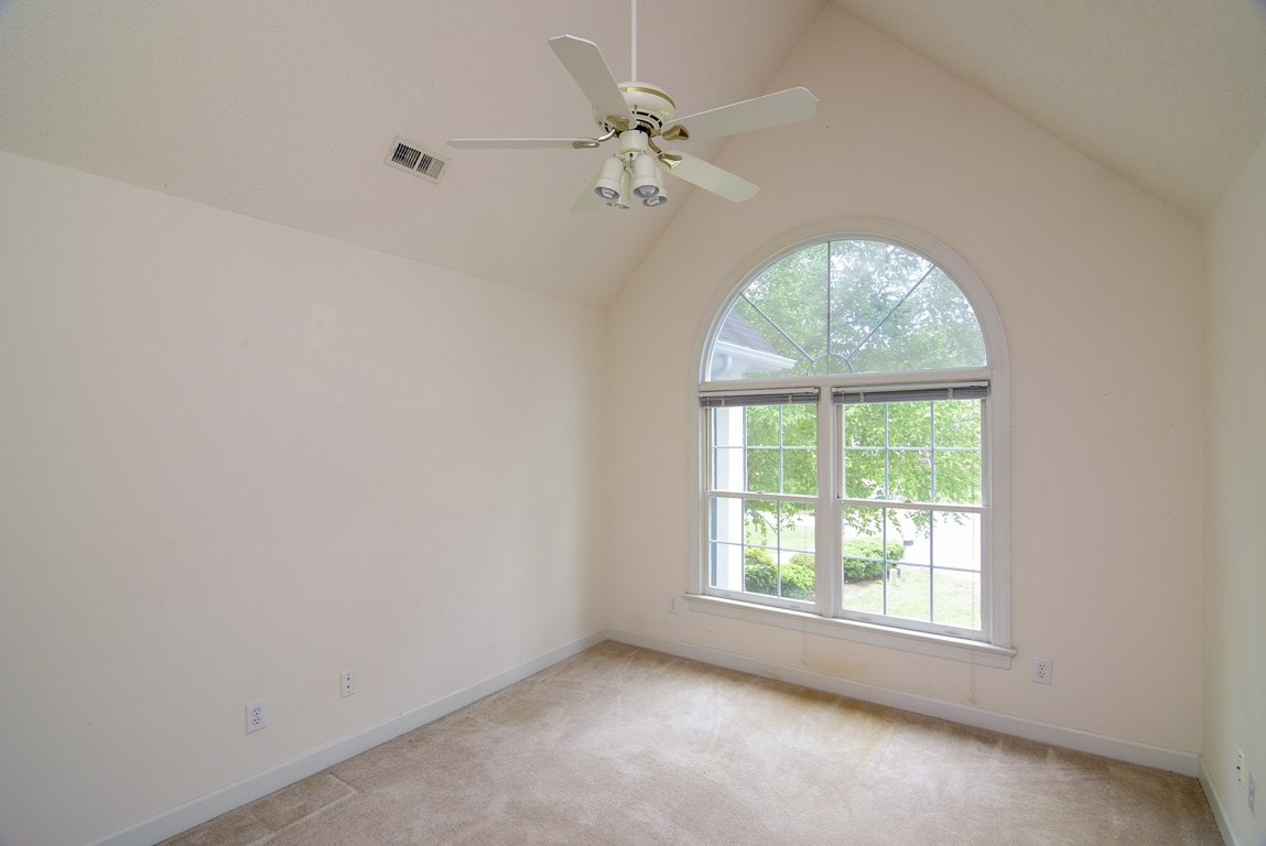 8808 Salute Street Raleigh, NC 27615 - Photo 15 of 25 Beautiful palladium window and vaulted ceiling make this room very special. Also has a walk-in-storage, which is completely floored and can easily be finished making this one of the largest rooms in the house. Bedroom