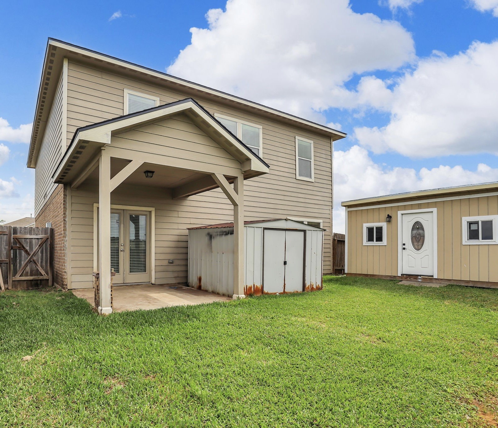 21307 Carleen Creek Trail Spring, TX 77379 - Photo 23 of 25 Charming two-story home with a covered patio, adjacent storage shed.