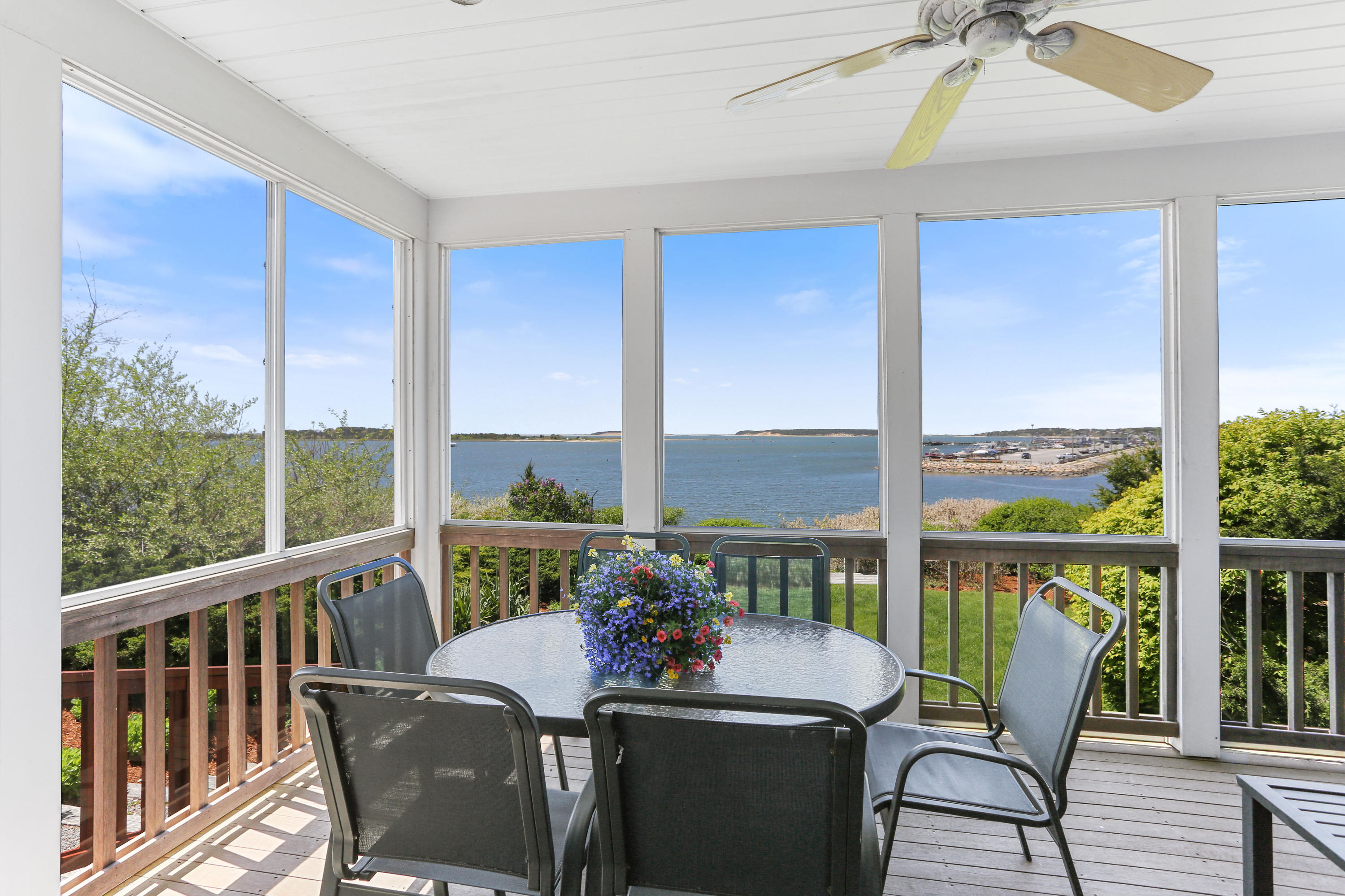 137 Nauhaught Bluff Road Wellfleet, MA 02667 - Photo 11 of 33 a view of a dining room with furniture window and outside view