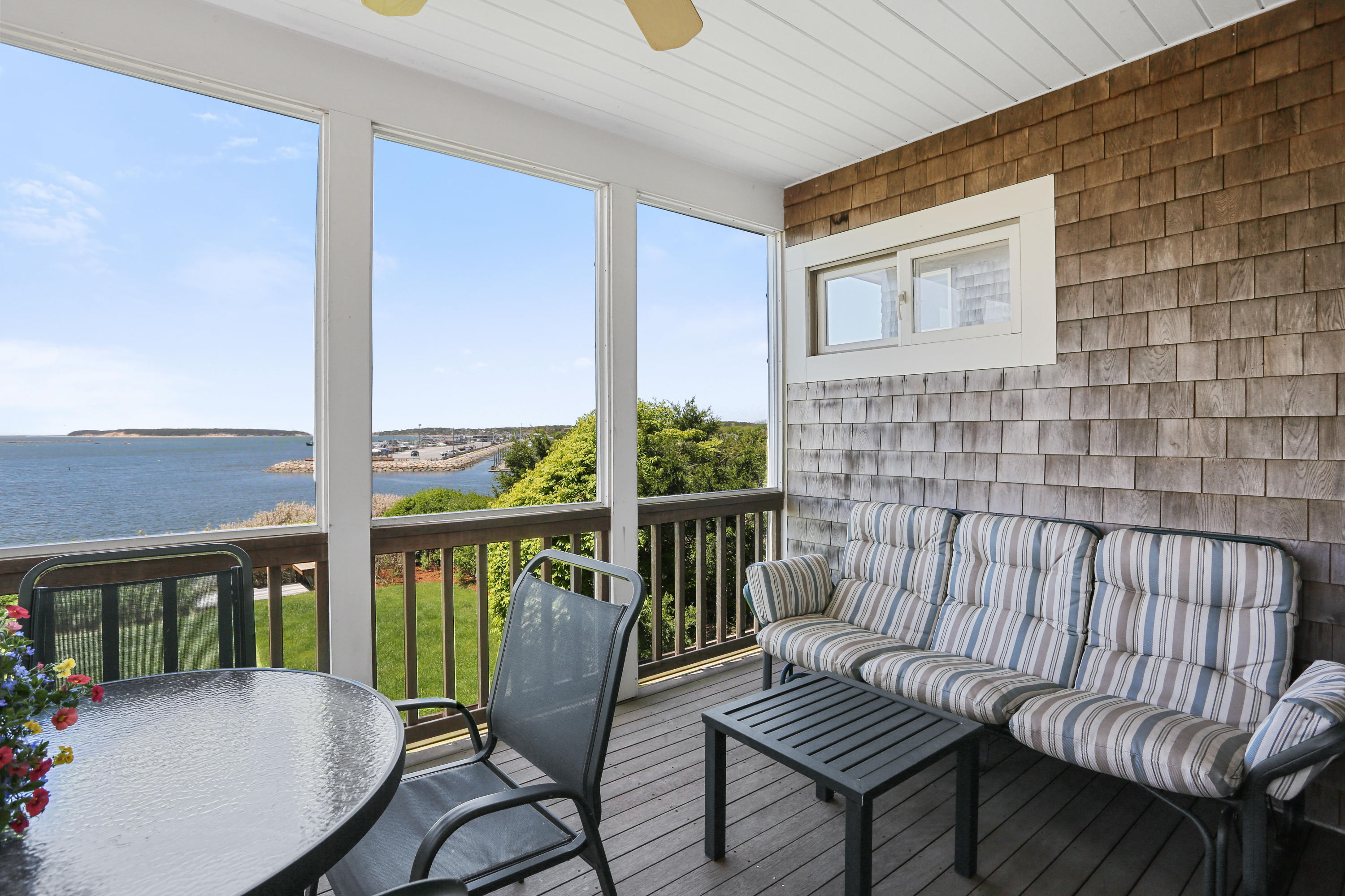 137 Nauhaught Bluff Road Wellfleet, MA 02667 - Photo 12 of 33 a view of a balcony with chairs