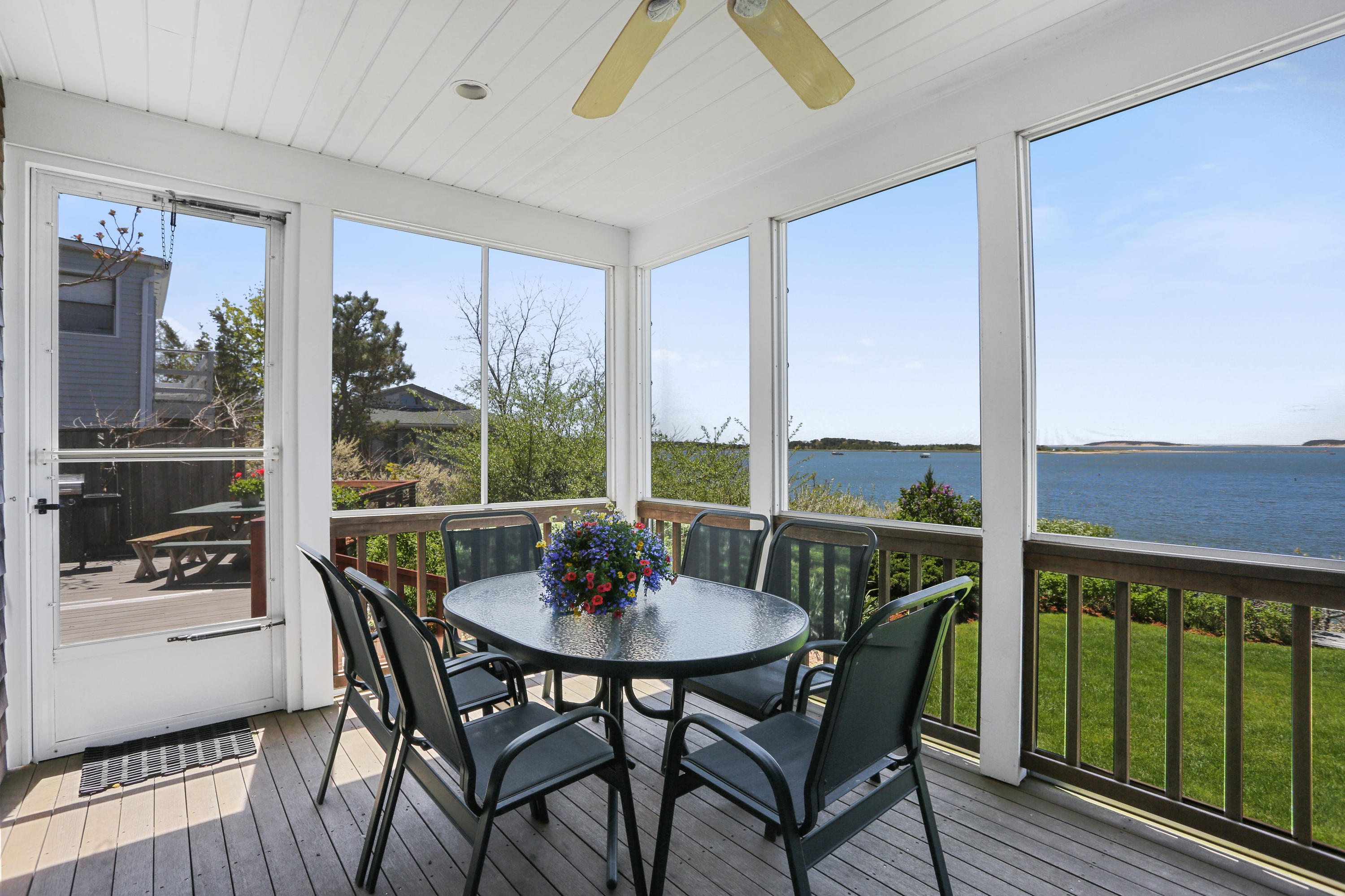 137 Nauhaught Bluff Road Wellfleet, MA 02667 - Photo 13 of 33 a view of a dining room with furniture window and wooden floor