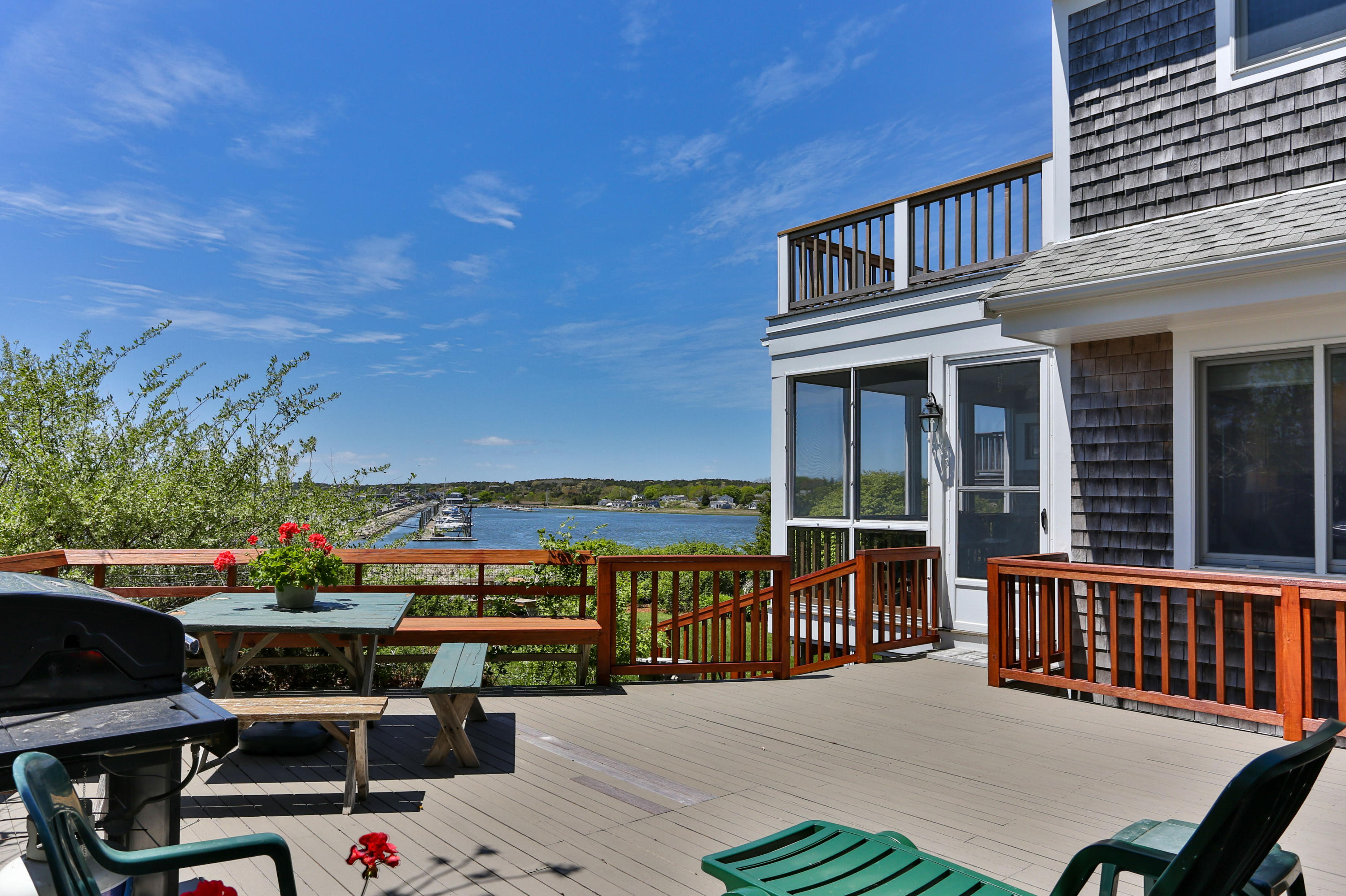 137 Nauhaught Bluff Road Wellfleet, MA 02667 - Photo 14 of 33 a view of a chairs and table in patio