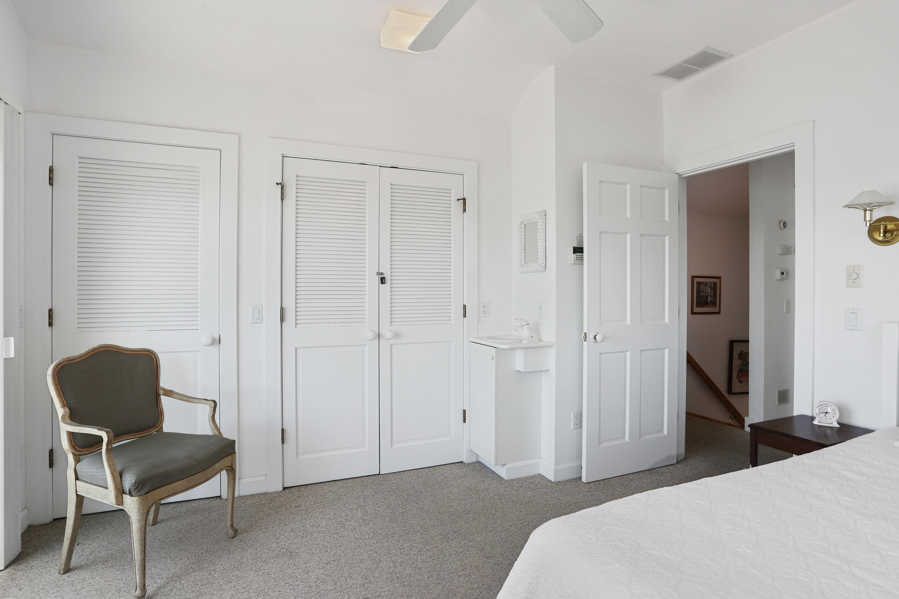 137 Nauhaught Bluff Road Wellfleet, MA 02667 - Photo 21 of 33 a bedroom with a bed and a chair