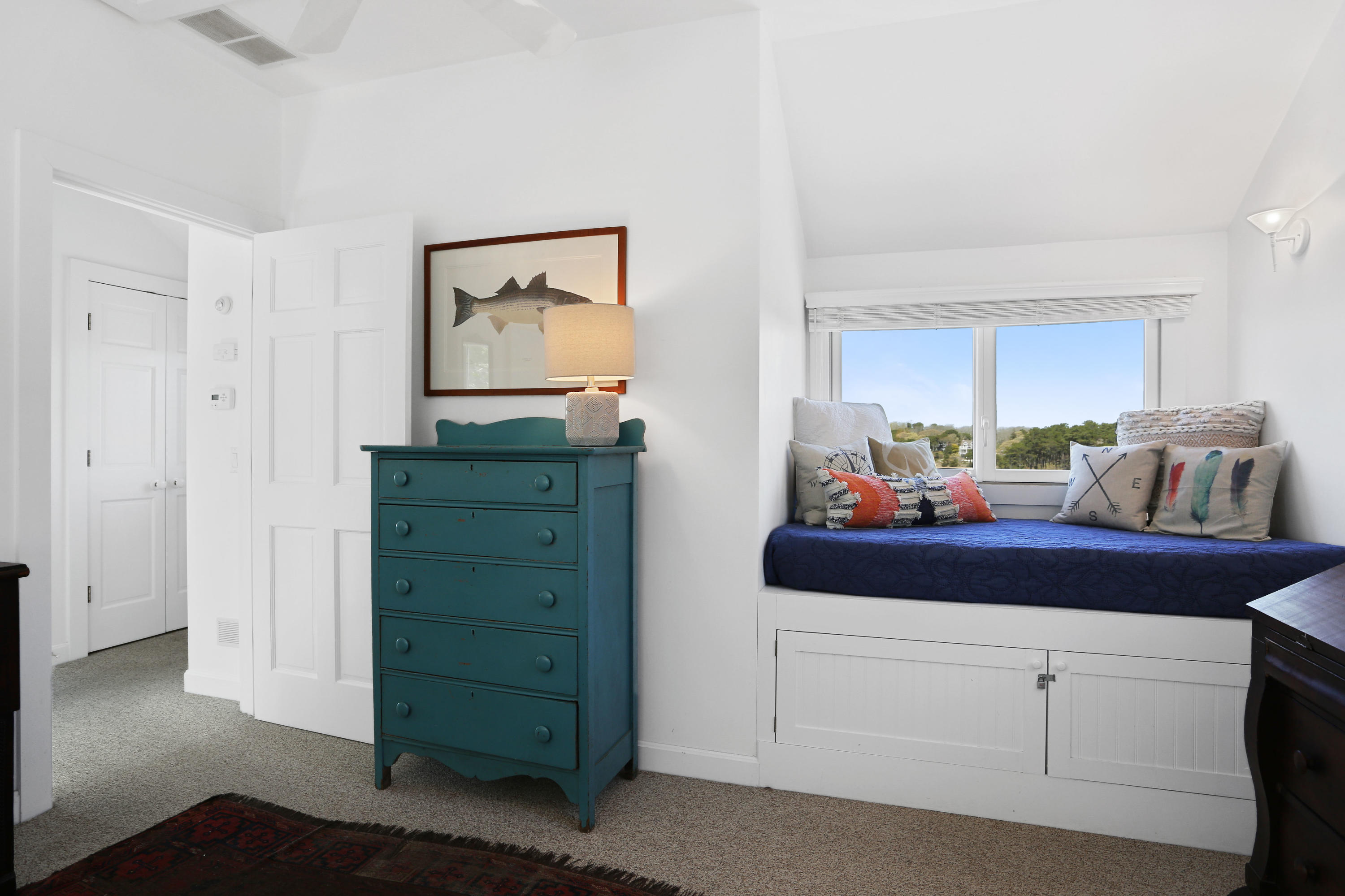 137 Nauhaught Bluff Road Wellfleet, MA 02667 - Photo 24 of 33 a room with a cabinets and a dresser