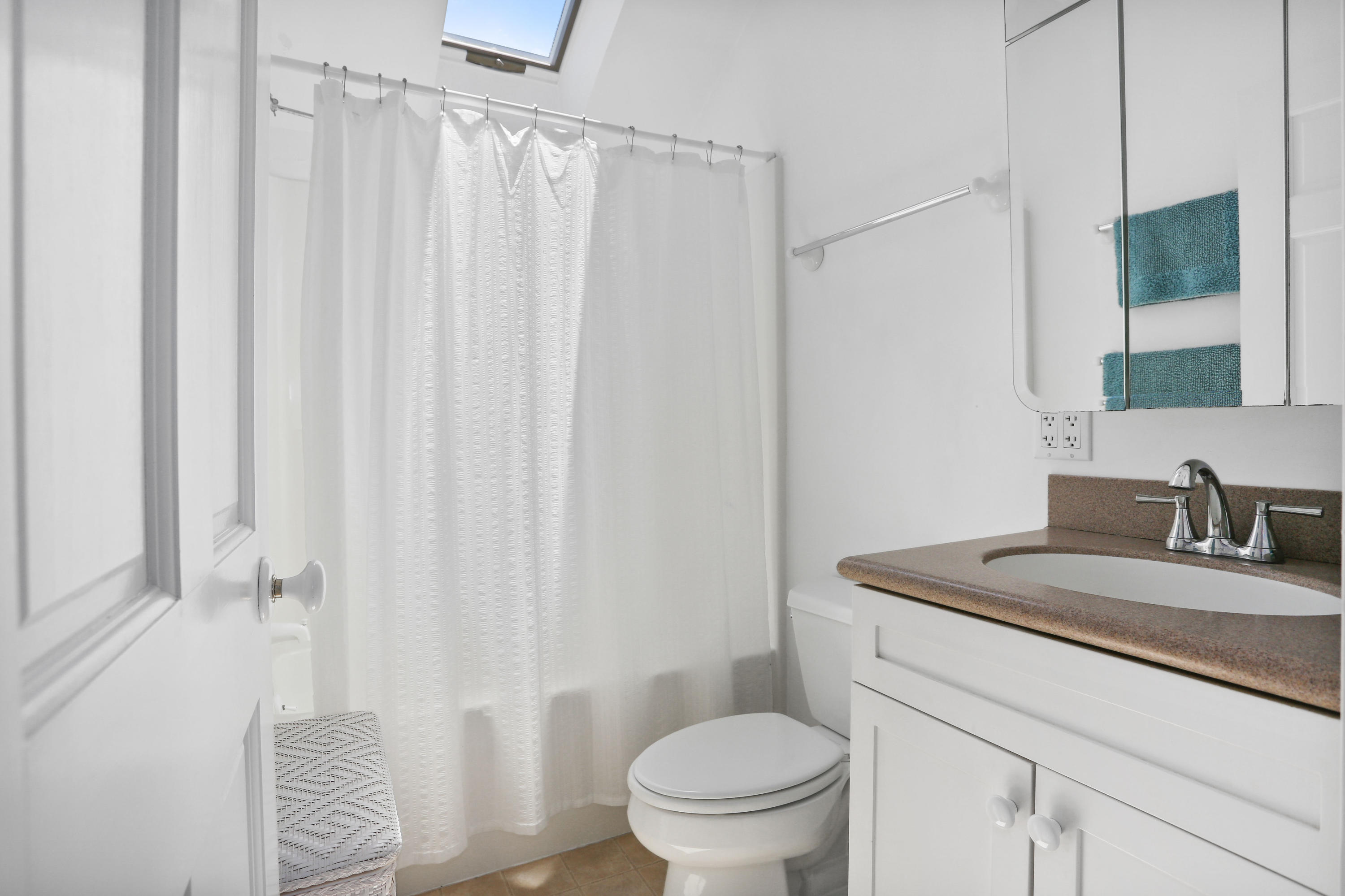 137 Nauhaught Bluff Road Wellfleet, MA 02667 - Photo 25 of 33 a bathroom with a granite countertop sink vanity mirror and toilet