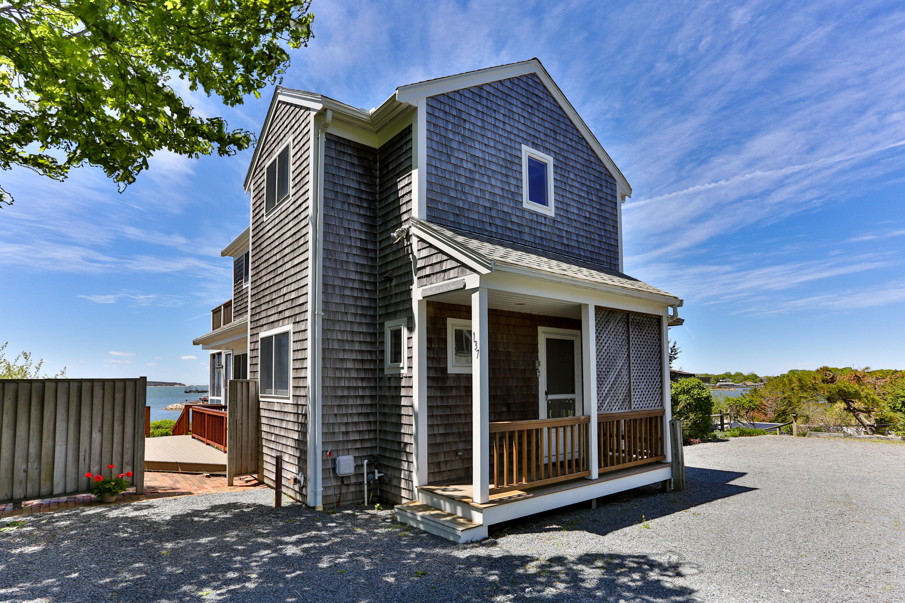 137 Nauhaught Bluff Road Wellfleet, MA 02667 - Photo 32 of 33 a view of a house with a yard