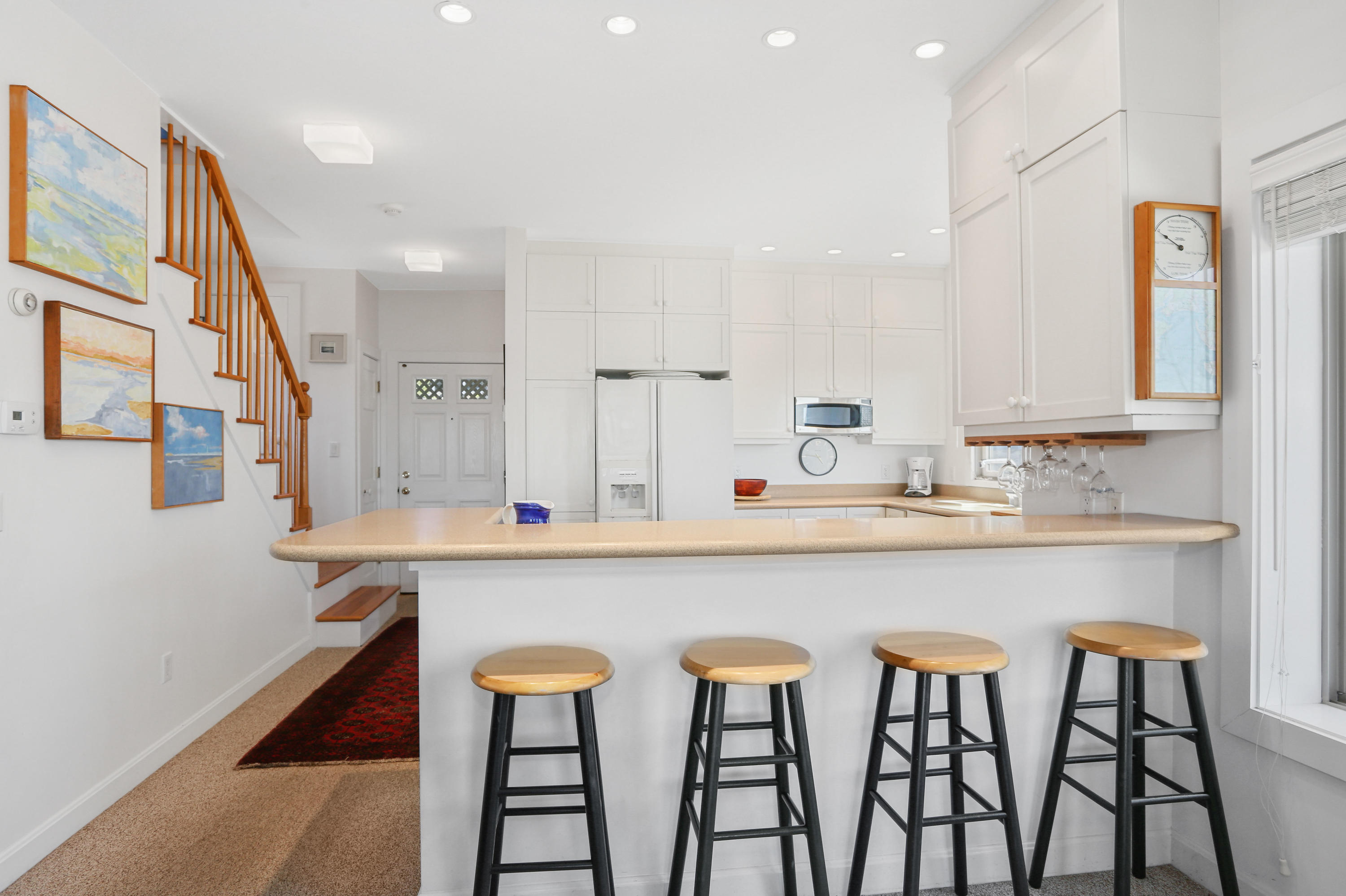 137 Nauhaught Bluff Road Wellfleet, MA 02667 - Photo 7 of 33 a kitchen with stainless steel appliances a sink and a refrigerator