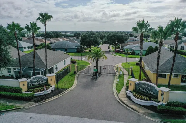 a view of a swimming pool with lawn chairs