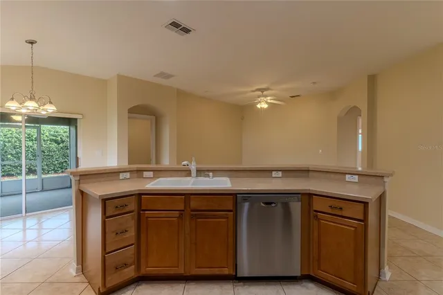 a bathroom with a granite countertop sink a vanity and a large mirror