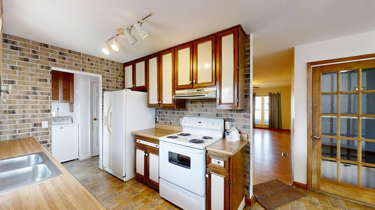 1002 Goldenview Drive Champaign, IL 61821 - Photo 11 of 38 a kitchen with a stove a refrigerator and a sink