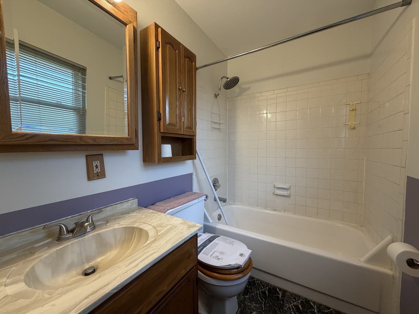 1002 Goldenview Drive Champaign, IL 61821 - Photo 18 of 38 a bathroom with a sink and a bathtub