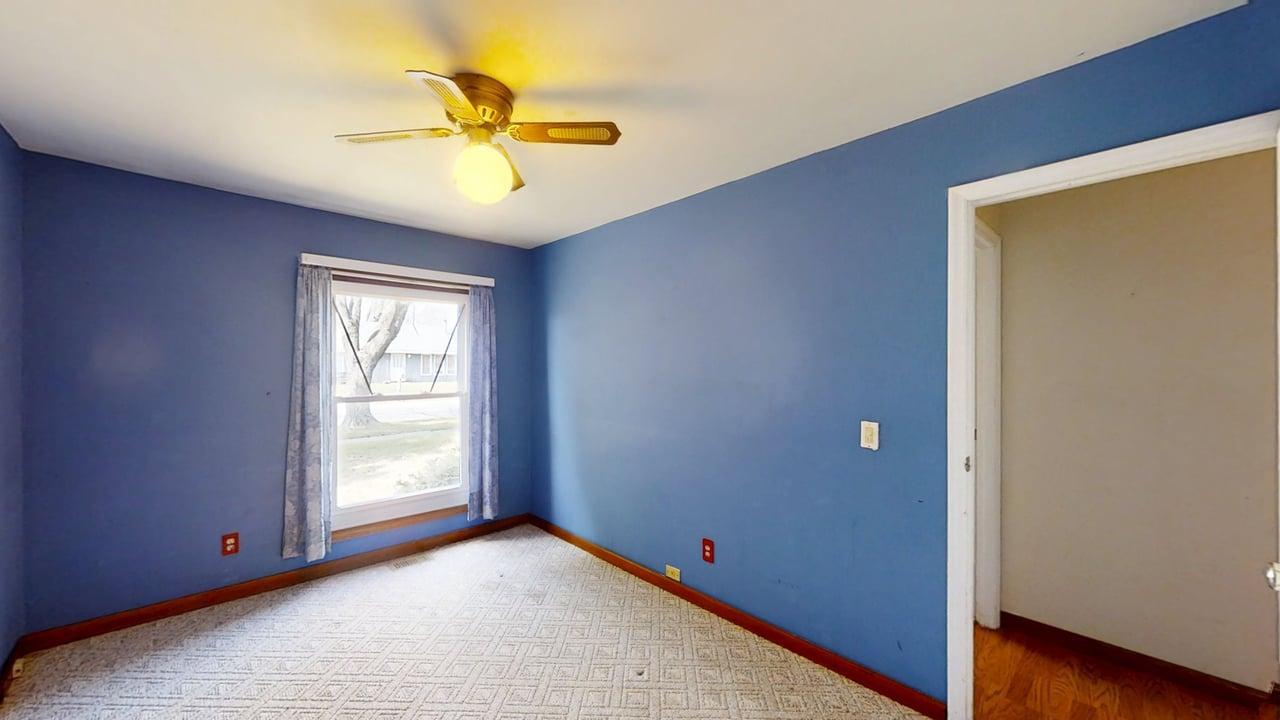 1002 Goldenview Drive Champaign, IL 61821 - Photo 20 of 38 an empty room with closet and a chandelier fan