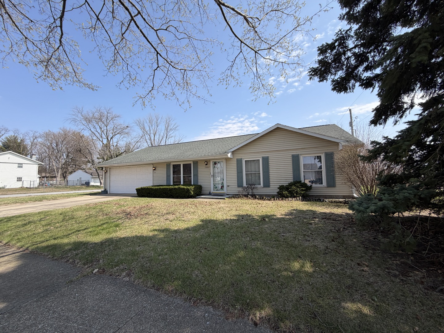1002 Goldenview Drive Champaign, IL 61821 - Photo 2 of 38 a front view of a house with a yard covered in snow