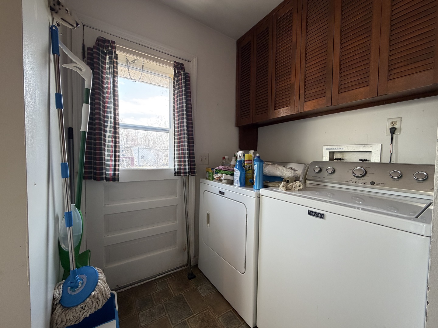 1002 Goldenview Drive Champaign, IL 61821 - Photo 33 of 38 a kitchen with a sink cabinets and a window