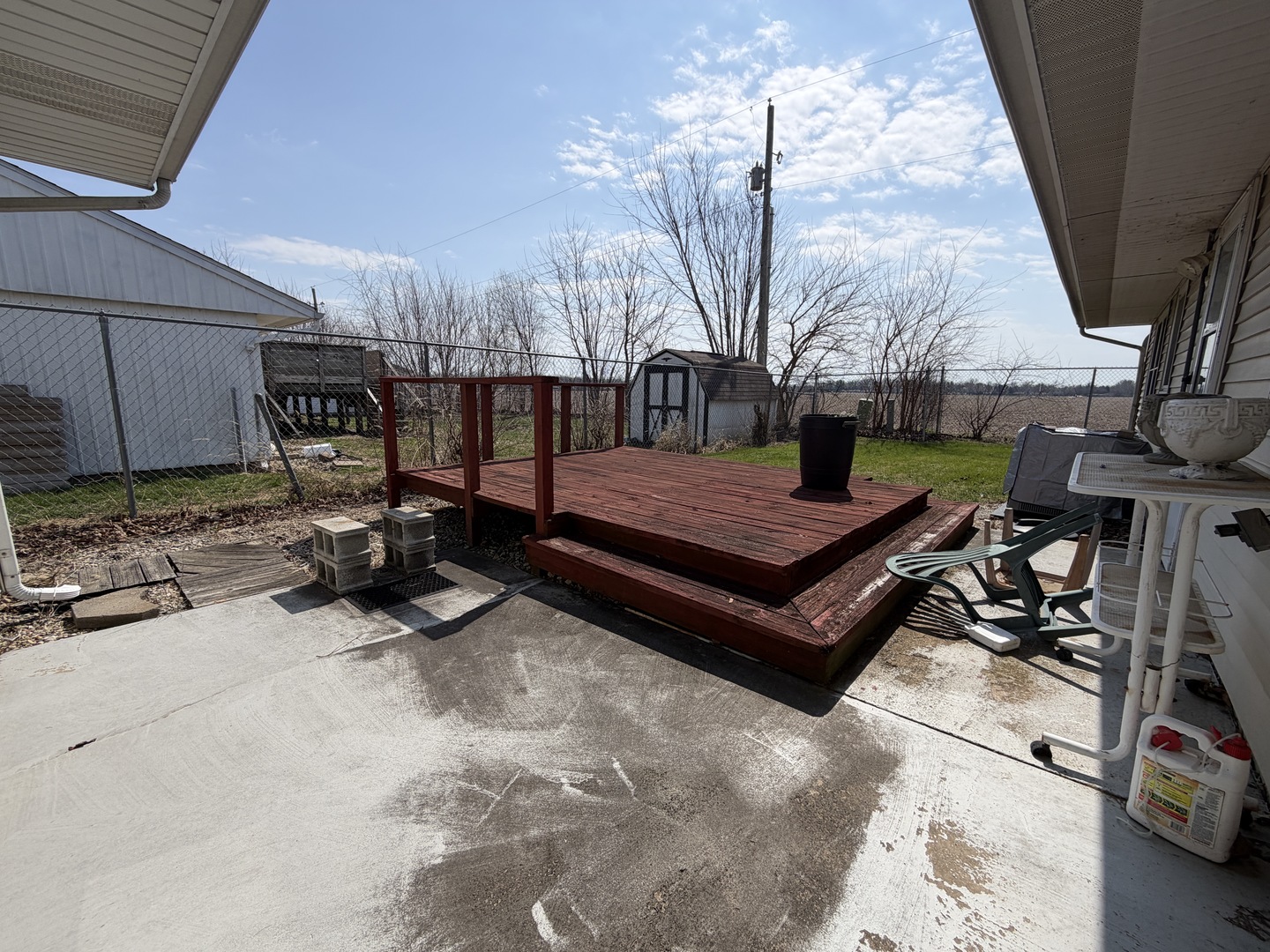 1002 Goldenview Drive Champaign, IL 61821 - Photo 35 of 38 a backyard of a house with barbeque oven table and chairs