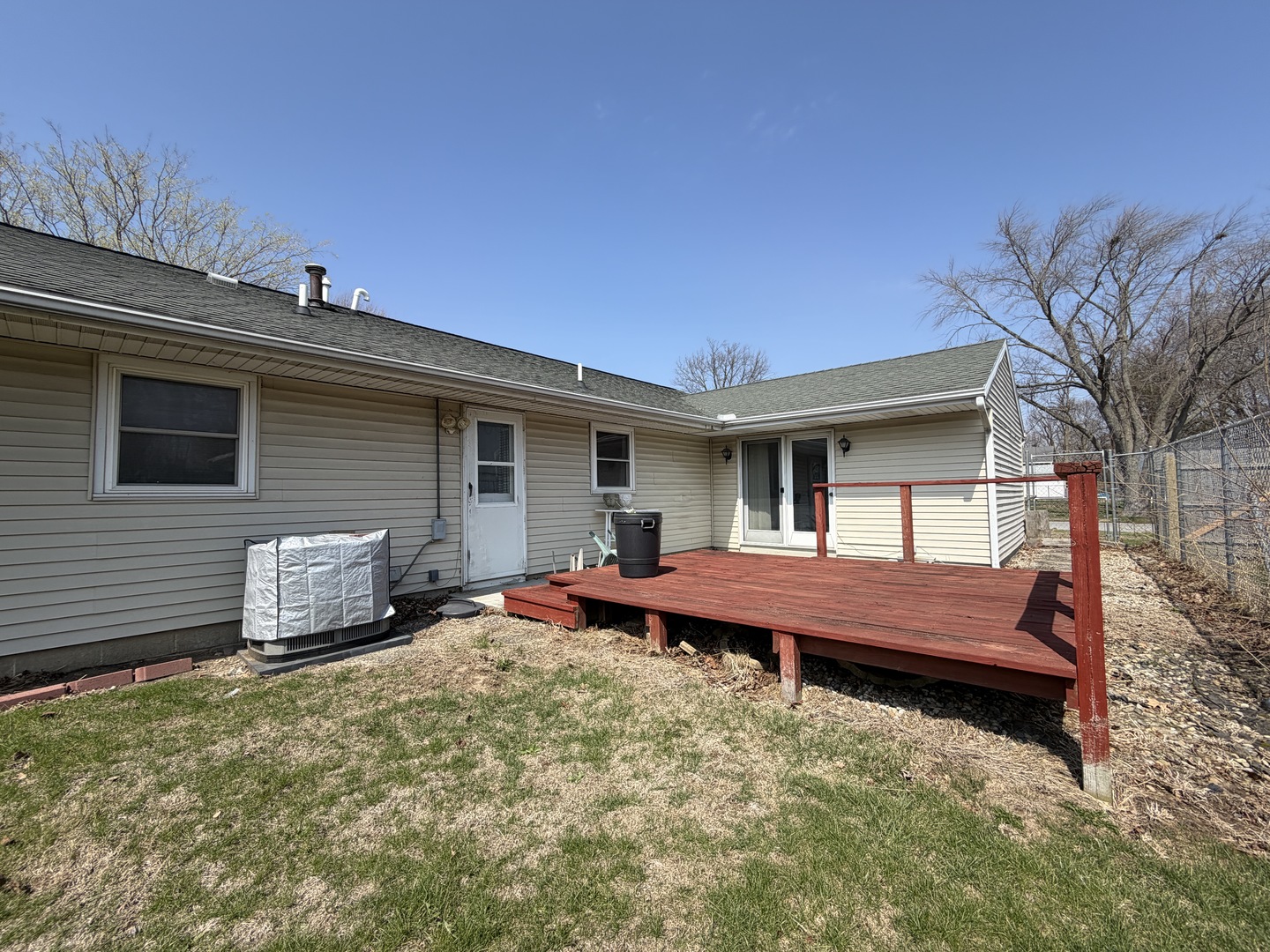1002 Goldenview Drive Champaign, IL 61821 - Photo 36 of 38 a wooden bench sitting in front of a house