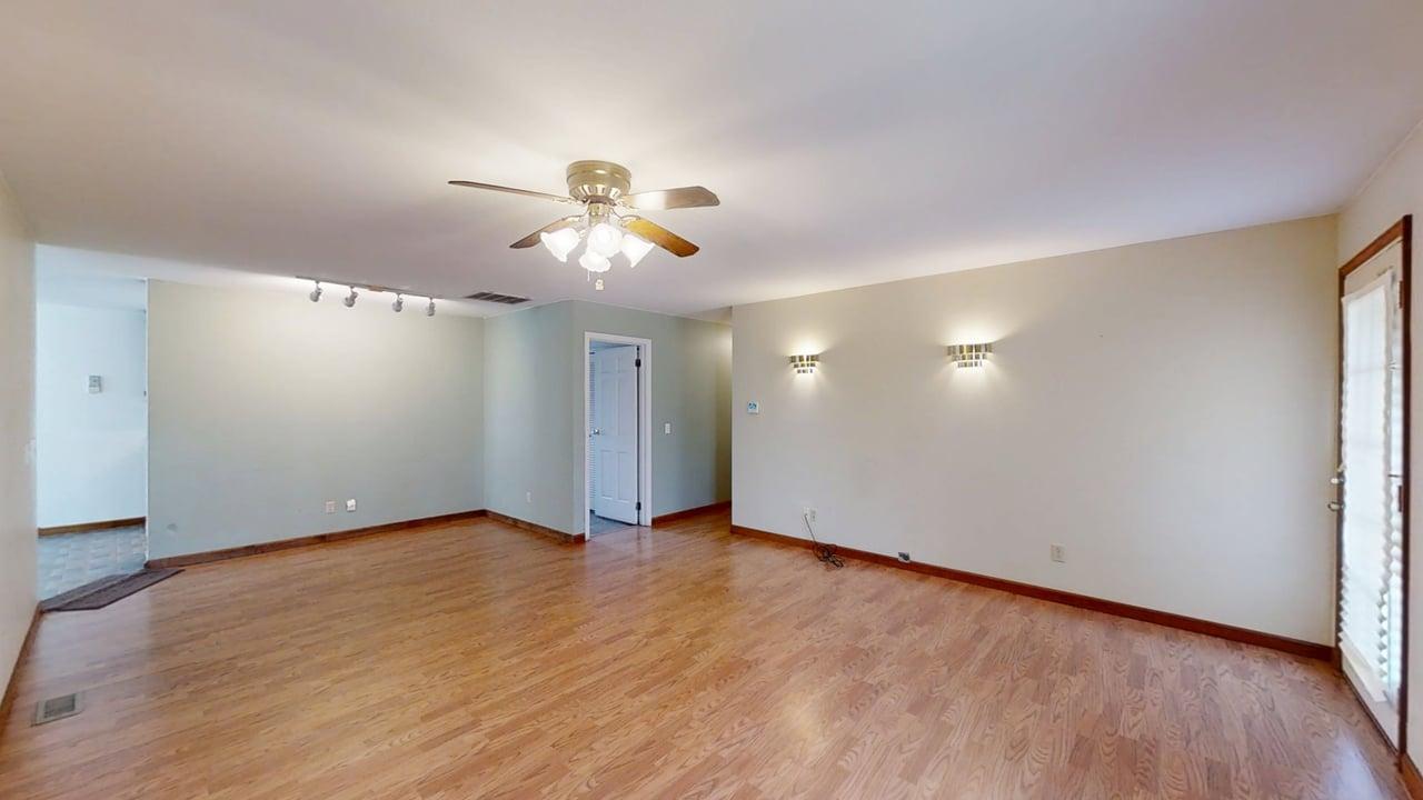1002 Goldenview Drive Champaign, IL 61821 - Photo 4 of 38 wooden floor in an empty room with a window