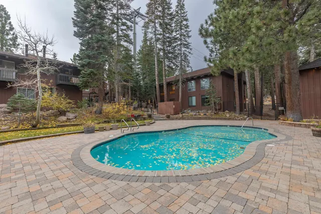 a view of a swimming pool with a patio