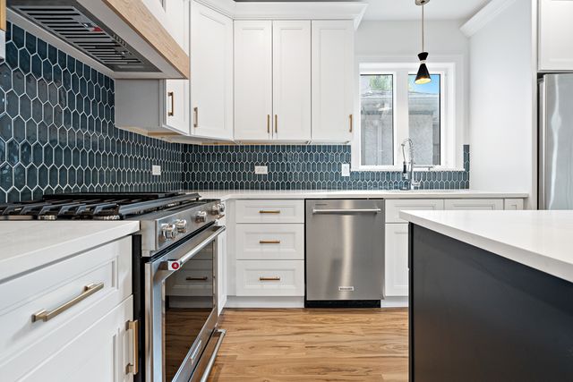 a kitchen with a stove and a sink