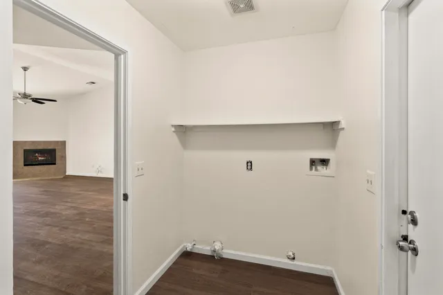 a view of backyard with tub and door