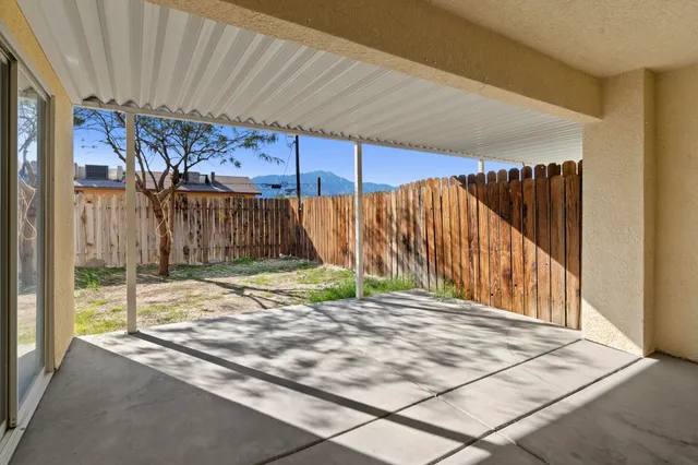 a view of a house with backyard and porch