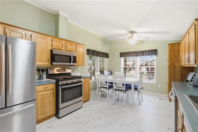 a kitchen with a stove a sink and a refrigerator