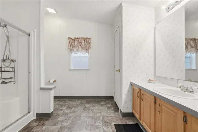a bathroom with a sink and a mirror