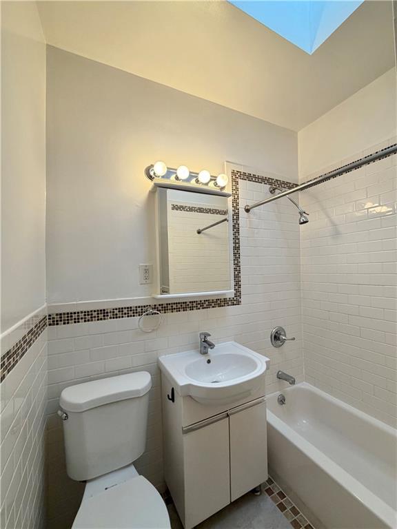 1077 Bay Ridge Parkway Brooklyn, NY 11228 - Photo 11 of 16 a bathroom with a sink a toilet and shower
