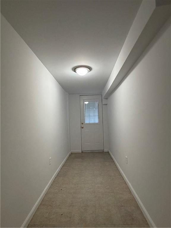 1077 Bay Ridge Parkway Brooklyn, NY 11228 - Photo 13 of 16 an empty room with a empty space and windows