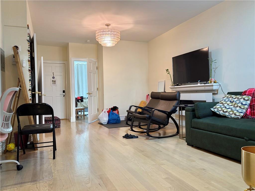 1077 Bay Ridge Parkway Brooklyn, NY 11228 - Photo 3 of 16 a living room with furniture and a flat screen tv