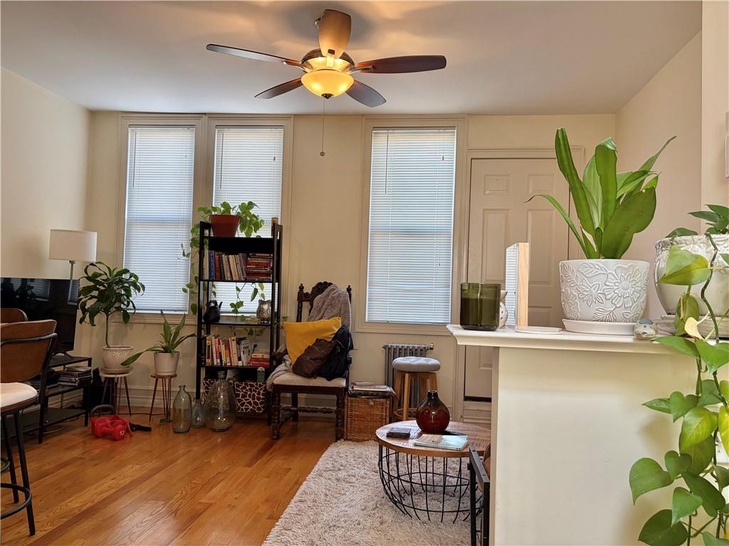 1077 Bay Ridge Parkway Brooklyn, NY 11228 - Photo 7 of 16 a living room with furniture and wooden floor