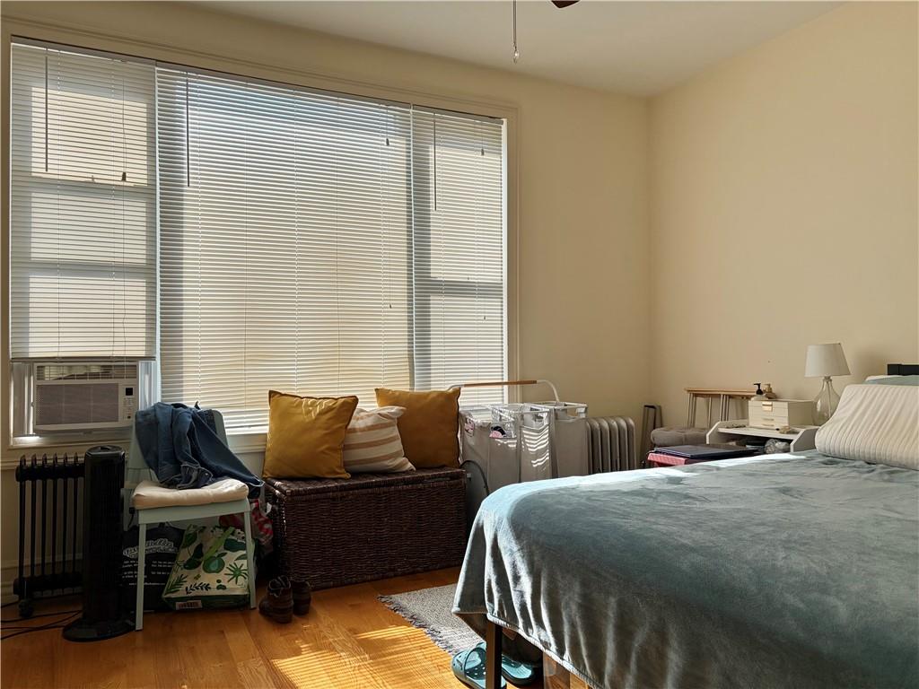 1077 Bay Ridge Parkway Brooklyn, NY 11228 - Photo 8 of 16 a bedroom with two beds and a couch