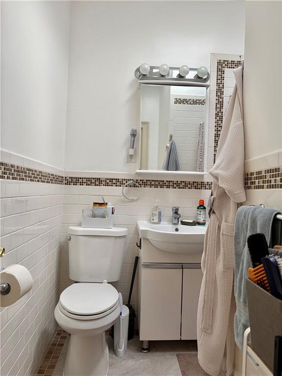 1077 Bay Ridge Parkway Brooklyn, NY 11228 - Photo 10 of 16 a bathroom with a sink and a toilet