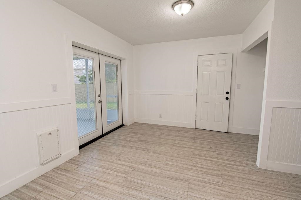 149 Pompano Road St. Augustine, FL 32086 - Photo 14 of 35 a view of empty room with wooden floor