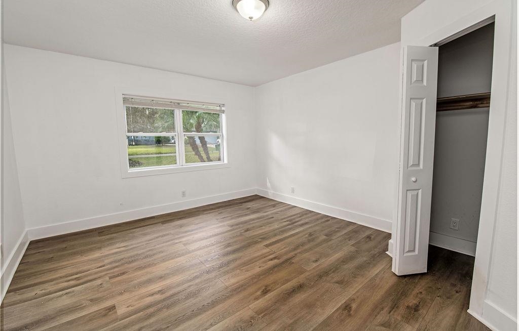 149 Pompano Road St. Augustine, FL 32086 - Photo 20 of 35 an empty room with wooden floor and a window