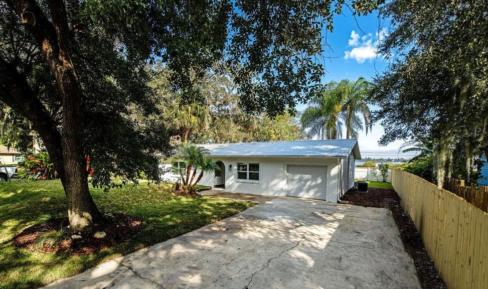 149 Pompano Road St. Augustine, FL 32086 - Photo 2 of 35 a view of a house with a backyard