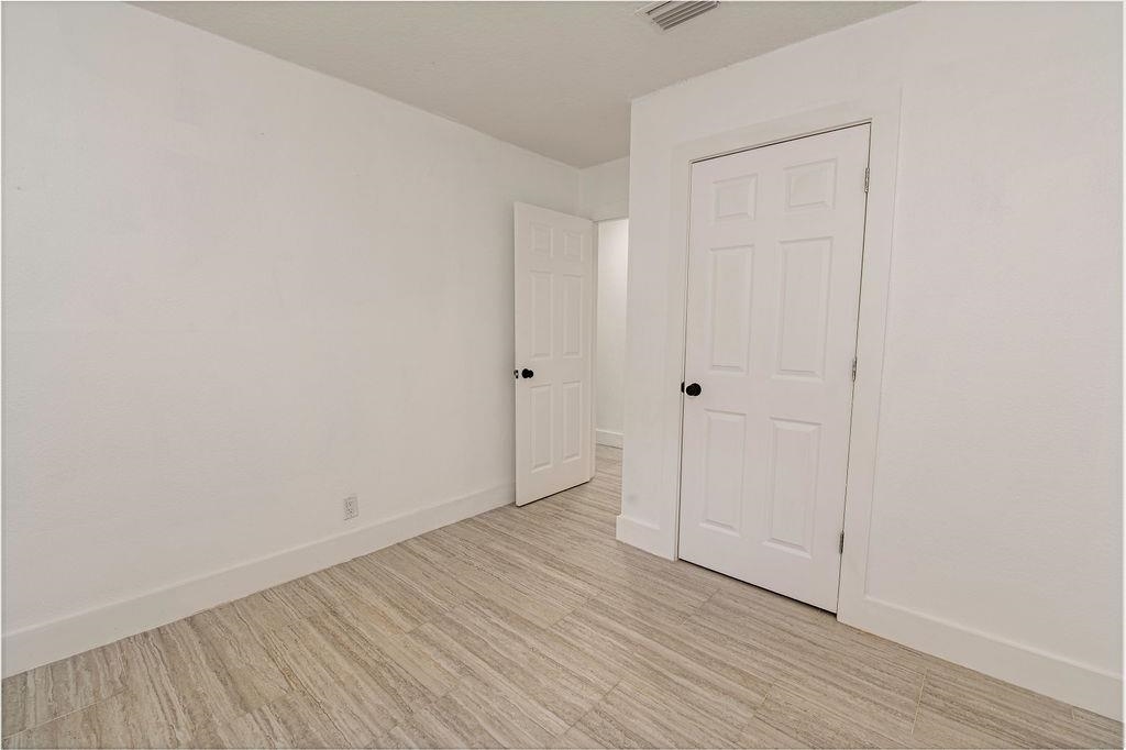 149 Pompano Road St. Augustine, FL 32086 - Photo 24 of 35 a view of an empty room with wooden floor