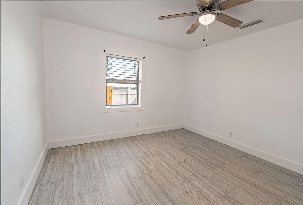 149 Pompano Road St. Augustine, FL 32086 - Photo 25 of 35 an empty room with a window and a fan