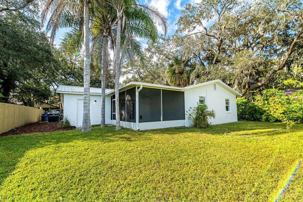 149 Pompano Road St. Augustine, FL 32086 - Photo 31 of 35 a view of a house with a yard and garage