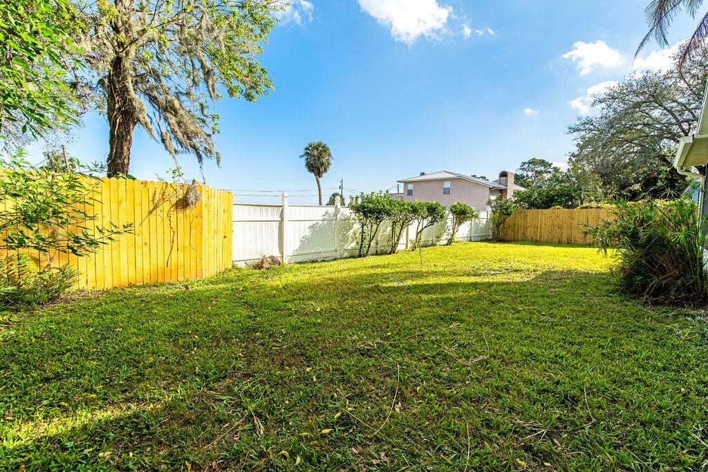 149 Pompano Road St. Augustine, FL 32086 - Photo 33 of 35 a view of an swimming pool with a yard